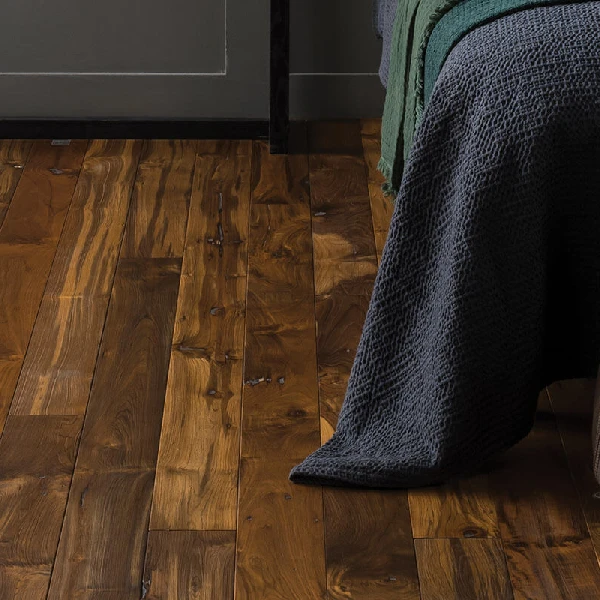 Deep-toned teak wood flooring with visible grain