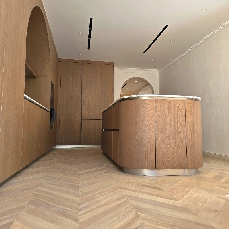 Large-scale Chevron oak flooring in a kitchen