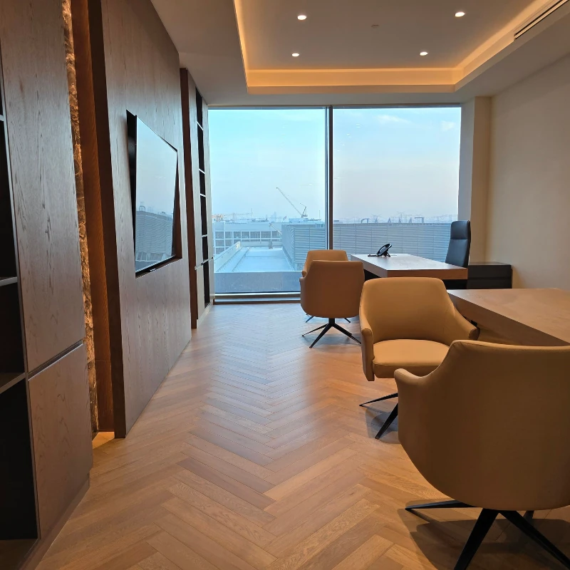 Large-scale Chevron oak flooring in a office