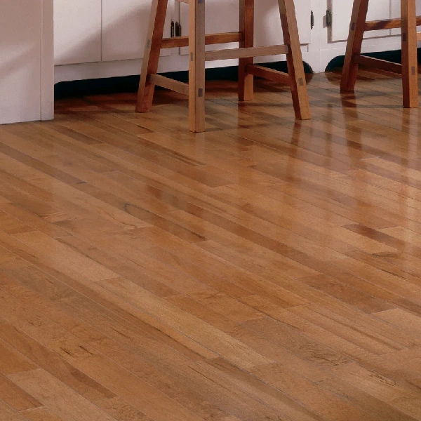 Polished maple wood flooring in a kitchen with wooden bar stools.
